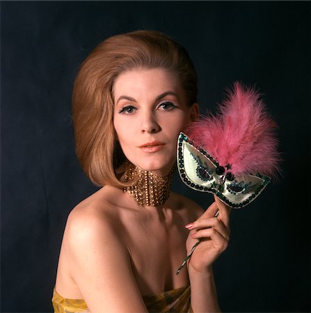 simsearch:846-05645665,k - 1960s GLAMOROUS WOMAN IN HIGH FASHION EVENING GOWN HOLDING MASQUERADE MASK Stock Photo - Rights-Managed, Code: 846-05646959