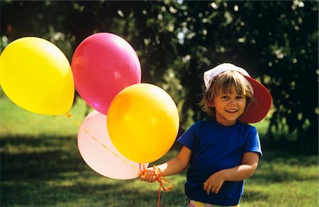 1990s BOY OUTDOORS HOLDING BALLOONS LOOKING AT CAMERA Stock Photo - Rights-Managed, Code: 846-05647110