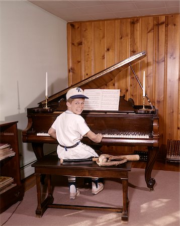 1960s BOY PLAYING PIANO WEARING BASEBALL UNIFORM Stock Photo - Rights-Managed, Code: 846-05647192