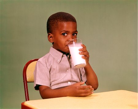 1960s AFRICAN-AMERICAN BOY DRINKING GLASS OF DAIRY MILK Stock Photo - Rights-Managed, Code: 846-05647265