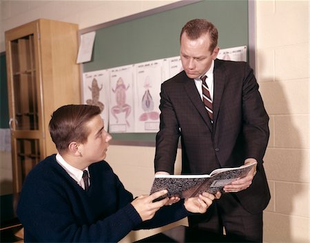 1960s TEACHER AND STUDENT REVIEWING NOTES IN SCIENCE CLASSROOM Stock Photo - Rights-Managed, Code: 846-05647473