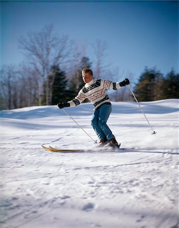 simsearch:846-02797740,k - 1970s BLOND MAN IN SCANDINAVIAN SWEATER DOWNHILL SKIING Stock Photo - Rights-Managed, Code: 846-05647575