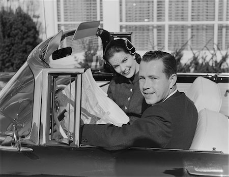 simsearch:846-06112141,k - 1950s HUSBAND WIFE MAN WOMAN IN AUTOMOBILE READING MAP Stock Photo - Rights-Managed, Code: 846-05647670