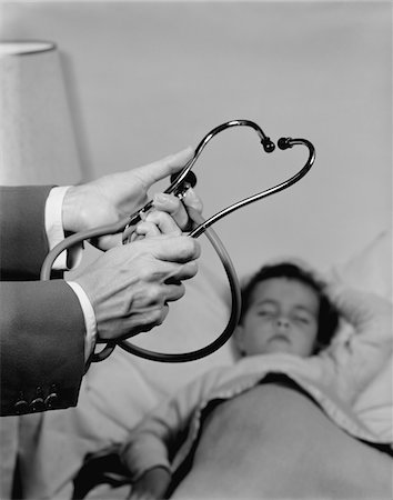 simsearch:846-05647696,k - 1960s DOCTOR HANDS HOLDING STETHOSCOPE LITTLE GIRL PATIENT SLEEPING AT HOME Stock Photo - Rights-Managed, Code: 846-05647684
