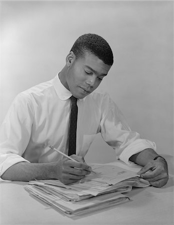 simsearch:846-02795767,k - 1950s - 1960s AFRICAN-AMERICAN MAN WORKING AT OFFICE DESK Stock Photo - Rights-Managed, Code: 846-05647722