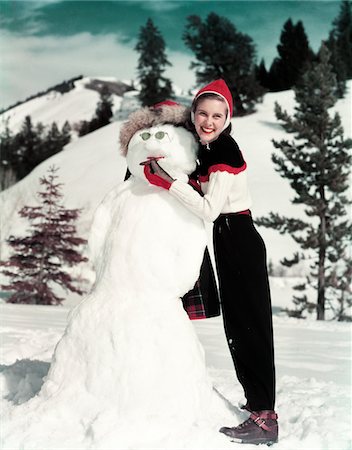 1940s - 1950s SMILING WOMAN HOLDING CIGAR IN SNOWMAN'S MOUTH Foto de stock - Con derechos protegidos, Código: 846-05647823