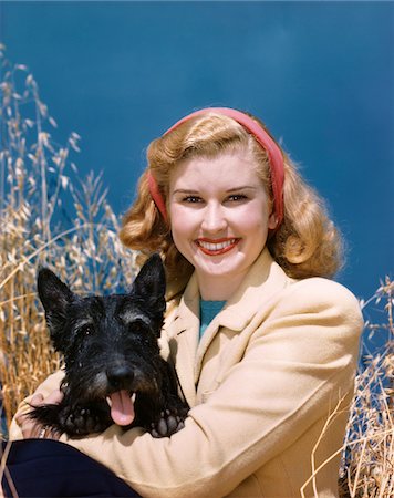 1940s PORTRAIT SMILING WOMAN HOLDING BLACK SCOTTIE DOG Stock Photo - Rights-Managed, Code: 846-05647854