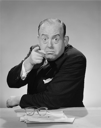 simsearch:846-05648291,k - 1950s - 1960s ANGRY BUSINESSMAN POINTING FINGER BULGING STARING EYES WIDE OPEN Stock Photo - Rights-Managed, Code: 846-05647916