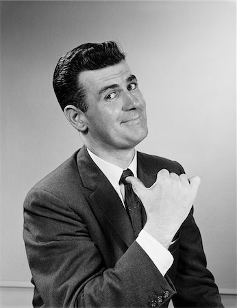 self satisfaction - 1950s BUSINESS MAN SMILING GIVING THUMBS UP SIGN POINTING TO HIMSELF Stock Photo - Rights-Managed, Code: 846-05647911