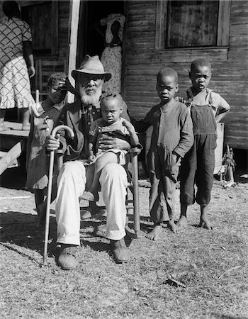 simsearch:846-06111874,k - 1939 ELDERLY AFRICAN AMERICAN MAN UNCLE AMBROSE DOUGLAS AGED 99 ONCE A SLAVE IS HOLDING THE YOUNGEST OF HIS 38 CHILDREN Stock Photo - Rights-Managed, Code: 846-05647970