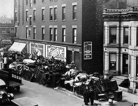 simsearch:846-02792671,k - 1930s GREAT DEPRESSION ERA MASS EVICTIONS PILES OF FURNITURE STACKED ALONG RESIDENTIAL STREET Stock Photo - Rights-Managed, Code: 846-05648036