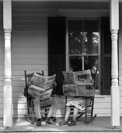 simsearch:846-02797888,k - 1950s - 1960s COUPLE MAN WOMAN SITTING ON PORCH IN ROCKING CHAIRS HOLDING NEWSPAPERS UP HIDING THEIR FACES Stock Photo - Rights-Managed, Code: 846-05648076