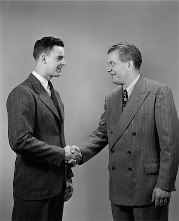 simsearch:640-03262464,k - 1940s - 1950s TWO BUSINESS MEN OF DIFFERENT GENERATIONS SHAKING HANDS Stock Photo - Rights-Managed, Code: 846-05648125