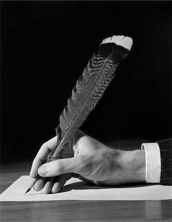 simsearch:846-02796457,k - 1930s MALE HAND WRITING WITH QUILL PEN FEATHER Stock Photo - Rights-Managed, Code: 846-05648152