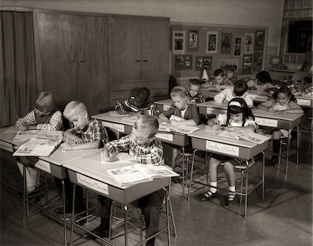 1960s ELEMENTARY CLASSROOM CHILDREN AT DESKS WRITING STUDYING Stock Photo - Rights-Managed, Code: 846-05648264