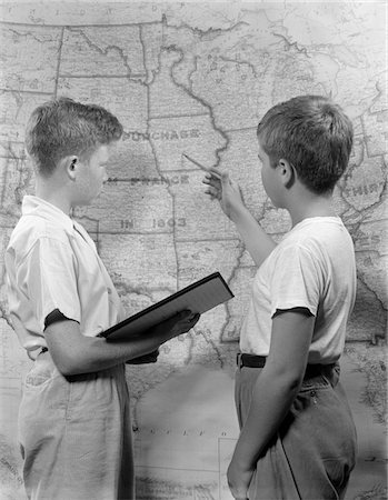 simsearch:846-02797888,k - 1950s TWO BOYS STUDYING MAP OF LOUISIANA PURCHASE Stock Photo - Rights-Managed, Code: 846-05648263