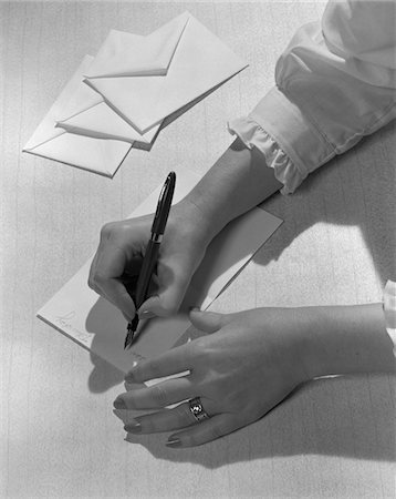 simsearch:846-02796457,k - 1950s - 1960s WOMAN'S HANDS HOLDING PEN WRITING LETTER ON STATIONERY Stock Photo - Rights-Managed, Code: 846-05648282