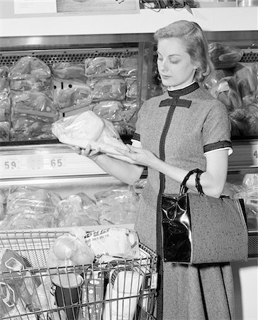 1950s - 1960s BLOND WOMAN SELECTING POULTRY IN SUPERMARKET Stock Photo - Rights-Managed, Code: 846-05648298