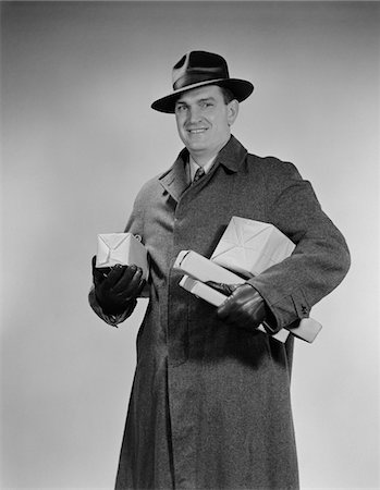 simsearch:846-05648541,k - 1940s MAN WEARING WINTER COAT HAT GLOVES HOLDING PACKAGES PARCELS Stock Photo - Rights-Managed, Code: 846-05648325