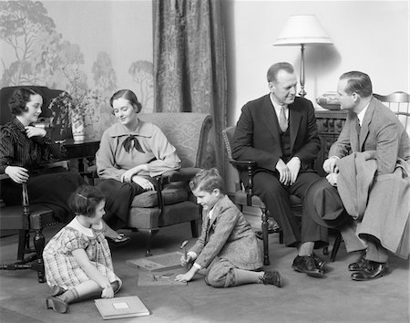 simsearch:846-02794130,k - 1930s FAMILY MOTHER FATHER TWO KIDS PLAYING ON FLOOR VISITING WITH ANOTHER COUPLE Stock Photo - Rights-Managed, Code: 846-05648334