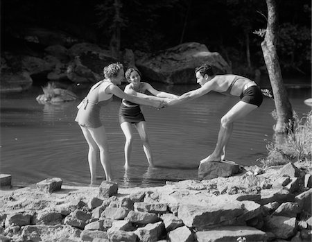 simsearch:846-05648202,k - 1920s - 1930s TWO WOMEN PULLING MAN INTO WOODLAND SWIMMING POND ALL WEARING BATHING SUITS Stock Photo - Rights-Managed, Code: 846-05648331