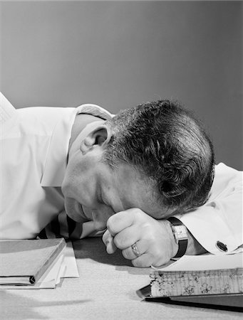 simsearch:846-02795767,k - 1950s MAN WITH HEAD ON DESK IN FRUSTRATION EXHAUSTION Stock Photo - Rights-Managed, Code: 846-05648340