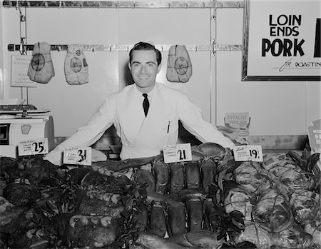 1930s - 1940s PORTRAIT SMILING MAN BUTCHER GROCER AT MEAT COUNTER Stock Photo - Rights-Managed, Code: 846-05648368