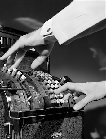 1930s MAN'S HANDS PUSHING BUTTONS ON CASH REGISTER Stock Photo - Rights-Managed, Code: 846-05648403