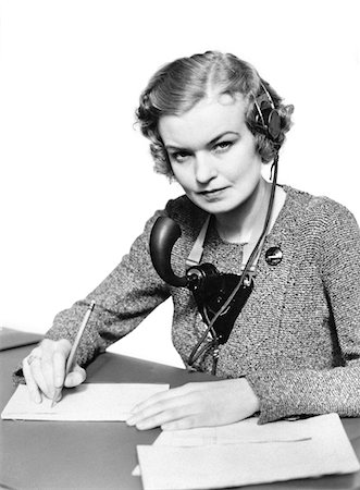 1930s PORTRAIT BUSINESS OFFICE WOMAN RECEPTIONIST WEARING HEADPHONES AND SPEAKER MICROPHONE SERIOUS LOOKING AT CAMERA Stock Photo - Rights-Managed, Code: 846-05648473