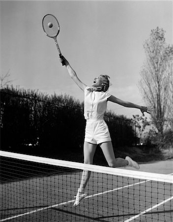 simsearch:846-05647924,k - 1950s WOMAN JUMPING TO HIT TENNIS BALL Stock Photo - Rights-Managed, Code: 846-05648504