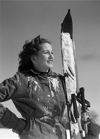 simsearch:846-02797740,k - 1940s SMILING WOMAN PORTRAIT HOLDING SKIS AND SKI POLES WINTER OUTDOOR Stock Photo - Rights-Managed, Code: 846-05648517