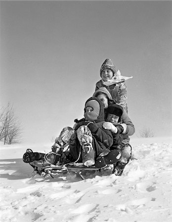 simsearch:846-02797888,k - 1960s GROUP OF FOUR KIDS PILED UP ON SLED Stock Photo - Rights-Managed, Code: 846-05648523