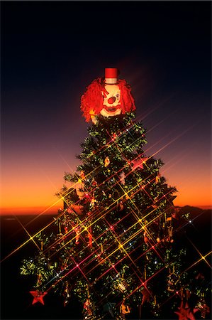 pictures old fashioned christmas trees - DECORATED CHRISTMAS TREE WITH CLOWN ON TOP Stock Photo - Rights-Managed, Code: 846-06111750