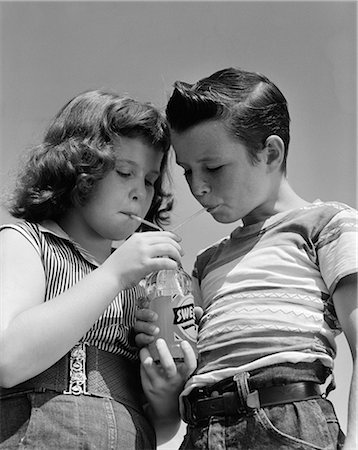 simsearch:846-05646226,k - 1950s GIRL AND BOY SHARE SODA TWO STRAWS SUMMER OUTDOOR Stock Photo - Rights-Managed, Code: 846-06111789