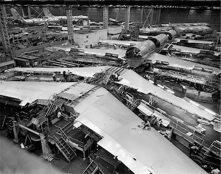 simsearch:846-02796426,k - 1960s OVERHEAD VIEW OF JET AIRPLANE ASSEMBLY LINE WITH SEVERAL PAIRS OF WING Stock Photo - Rights-Managed, Code: 846-06111908