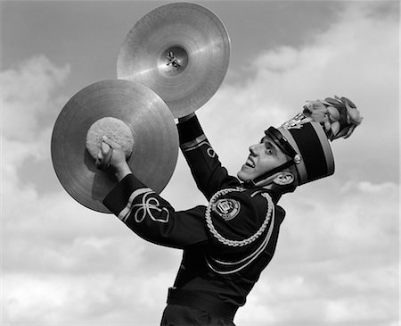 simsearch:846-05647924,k - 1960s PORTRAIT OF BOY IN BAND UNIFORM PLAYING INSTRUMENT CYMBALS OUTDOORS Stock Photo - Rights-Managed, Code: 846-06112180