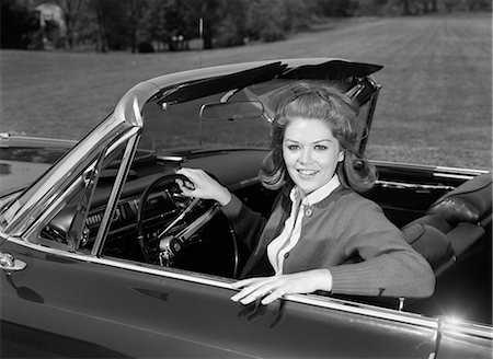 simsearch:846-06112141,k - 1960s SMILING TEENAGE WOMAN SITTING IN CONVERTIBLE CAR LOOKING AT CAMERA Stock Photo - Rights-Managed, Code: 846-06112191