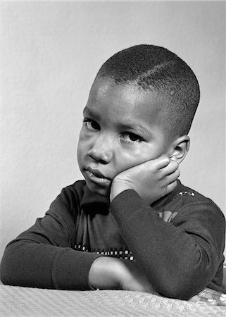 sad african children - 1940s 1950s PORTRAIT OF SAD UNHAPPY AFRICAN-AMERICAN BOY HEAD RESTING ON HAND LOOKING AT CAMERA Stock Photo - Rights-Managed, Code: 846-06112217