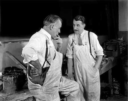 simsearch:846-05645898,k - 1930s TWO MEN WORKERS PAINTERS TALKING TOGETHER WEARING WHITE OVERALLS Stock Photo - Rights-Managed, Code: 846-06112266