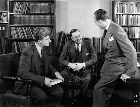simsearch:846-05648290,k - 1940s GROUP OF THREE BUSINESSMEN SITTING TOGETHER IN LIBRARY TALKING SMILING Stock Photo - Rights-Managed, Code: 846-06112401