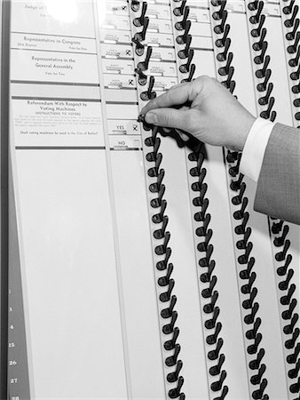 simsearch:846-05648291,k - 1950s MAN'S HAND PULLING LEVERS IN VOTING BOOTH Stock Photo - Rights-Managed, Code: 846-06112485