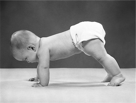 diaper girls picture - 1950s BABY GIRL PUSH UP ON ALL FOURS CRAWLING ON TIPTOES 7 MONTHS Stock Photo - Rights-Managed, Code: 846-07200049