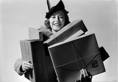 simsearch:846-08030416,k - 1930s 1940s WOMAN SHOPPING CARRYING LOTS OF PACKAGES LOOKING AT CAMERA Stock Photo - Rights-Managed, Code: 846-07200054
