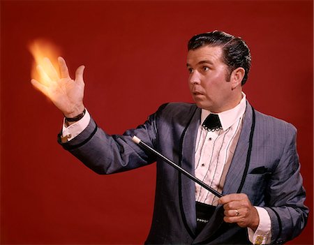 simsearch:400-04760873,k - 1970s MAN MAGIC MAGICIAN WAND Stock Photo - Rights-Managed, Code: 846-07760715