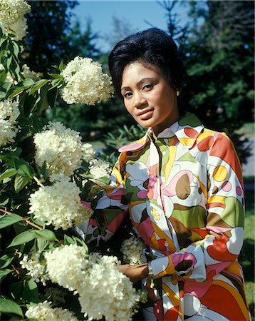 1970s PORTRAIT AFRICAN AMERICAN WOMAN IN FLOWER GARDEN LOOKING AT CAMERA Stock Photo - Rights-Managed, Code: 846-07760719