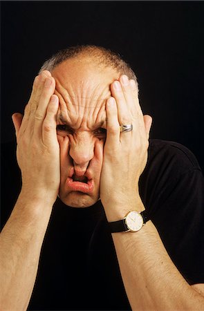 simsearch:846-08030391,k - PORTRAIT OF STRESSED MAN SCRUNCHING UP FACE WITH HANDS Stock Photo - Rights-Managed, Code: 846-07760740