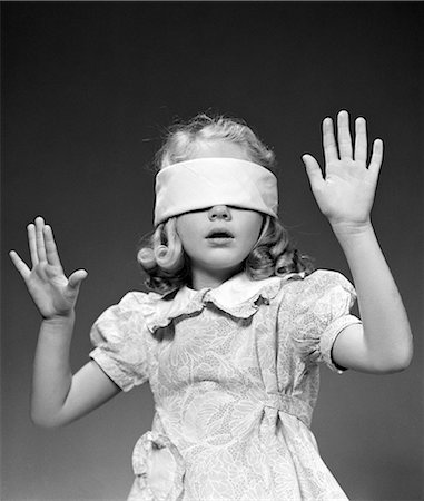 1940s BLOND GIRL WEARING BLINDFOLD ARMS UP IN AIR FEELING REACHING Stock Photo - Rights-Managed, Code: 846-08030370