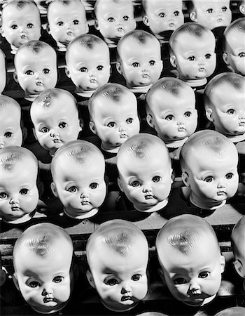 1950s ROWS OF BABY DOLL HEADS IN PRODUCTION LINE Stock Photo - Rights-Managed, Code: 846-08030422