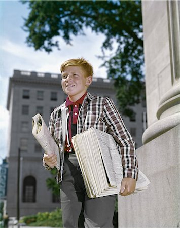 red haired teenage boy - 1960s SMILING BOY RED HAIR WEARING PLAID JACKET SELLING NEWSPAPERS ON SIDEWALK Stock Photo - Rights-Managed, Code: 846-08140060