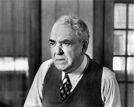 elderly sign - 1930s 1940s ELDERLY BUSINESS MAN VEST TIE CHARACTER WORRIED SERIOUS FACIAL EXPRESSION GRUMPY MEAN ANGRY Stock Photo - Rights-Managed, Code: 846-08140095